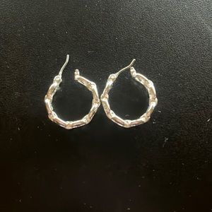 Silver tone hoop earrings with chain look